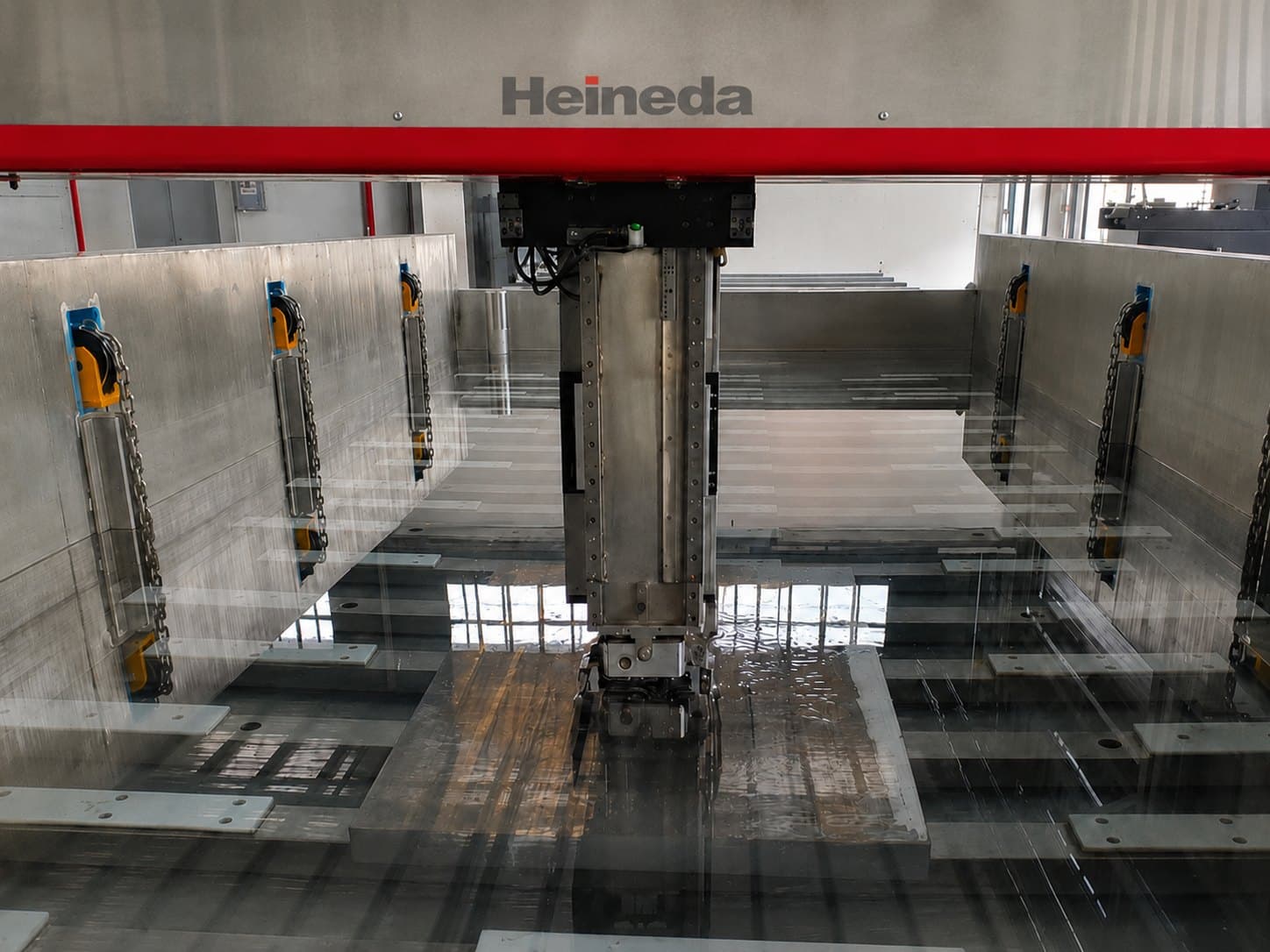 Five-axis immersion C-scan spindle scanning a forging in the tank